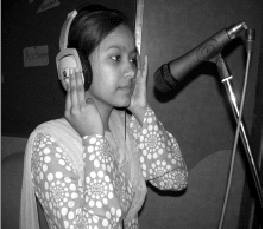 A 19 year-old woman from Shahbad, Daulatpur, a resettlement colony in North West Delhi in India is among the people behind a radio programme on disaster management, broadcast through the studio of One World South Asia. Photo by One World South Asia